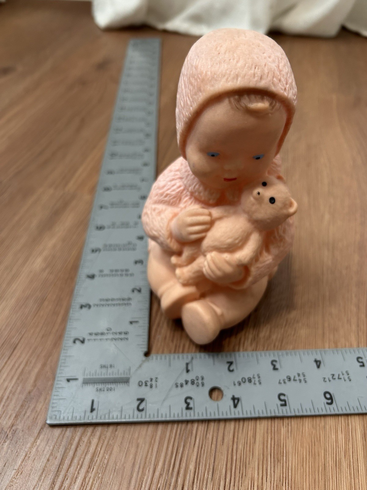 Mid 20th century model molded rubber baby figurine with teddy bear 6” height
