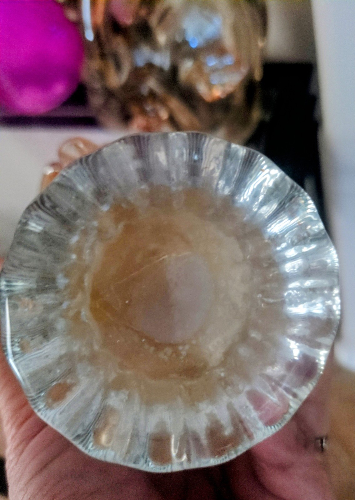 Hand-blown Italian art glass bowl with ruffled rim and iridescent finish. 6″