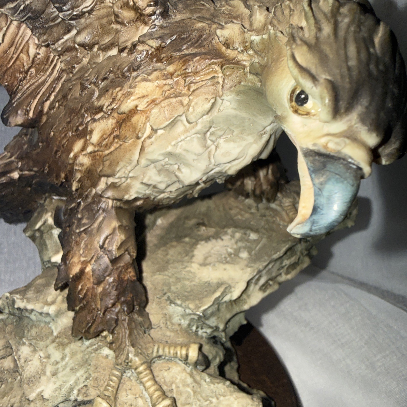 A resin sculpture with bronze-like finish of an Eagle by Giuseppe Armani 12”Tall