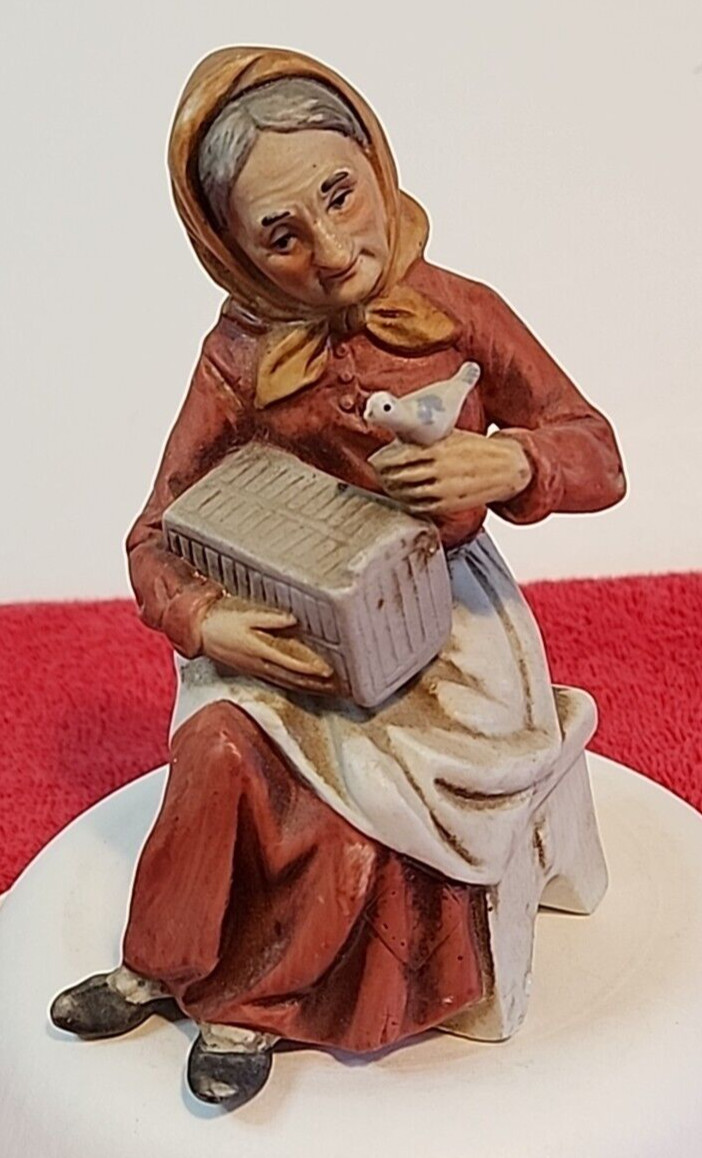 Vtg Grandma Flambro Figurine Lady with Bird Box on Bench Approx 5.5″