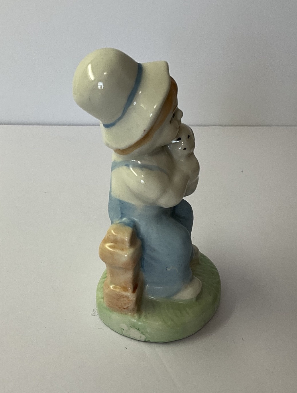Vintage Boy Figurine in Overalls Holding Lamb Sitting on Fence 4.50” Tall