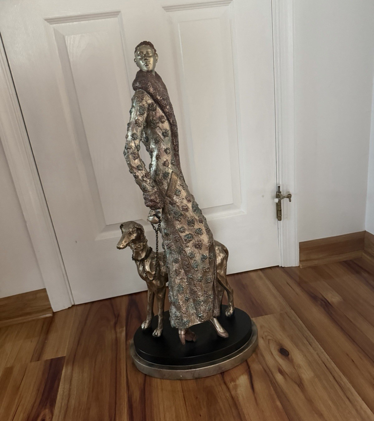 Metallic Finish Metal Figurine Woman with Dog on Round Base, Multicolor