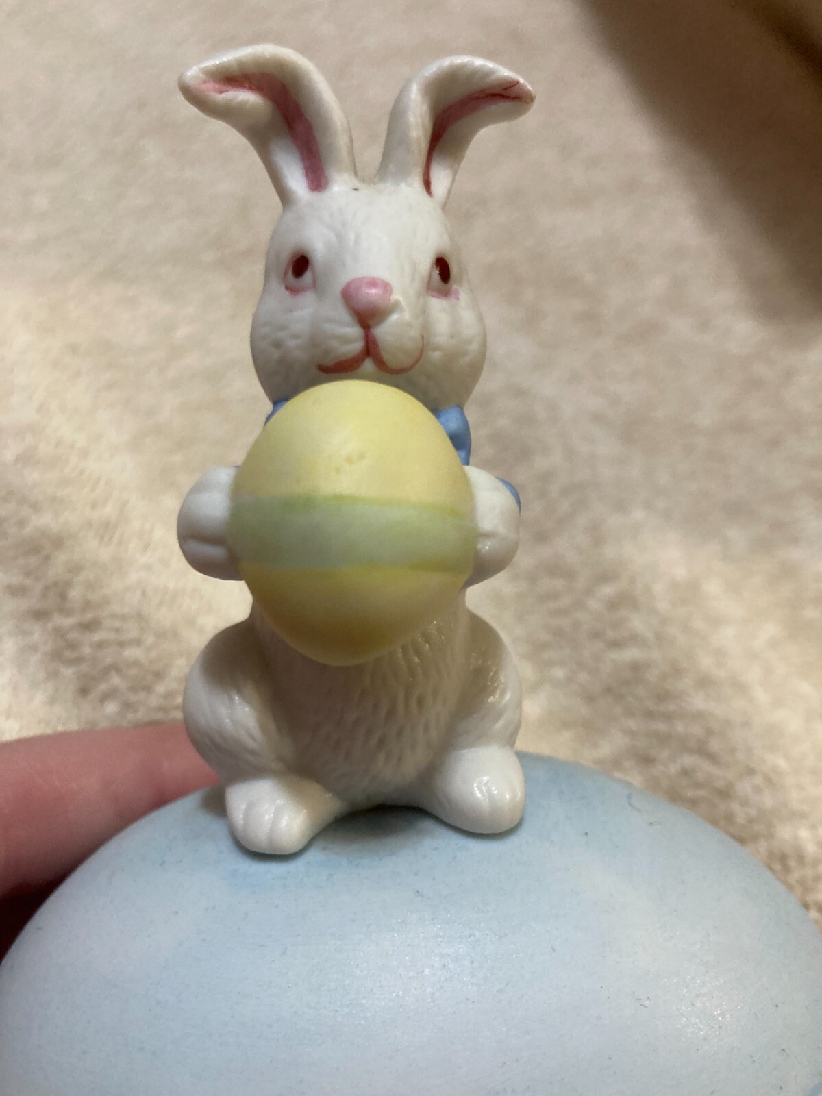 White Rabbit Holding onto Yellow +Green Egg 2 piece Egg that is Blue (Flawed)