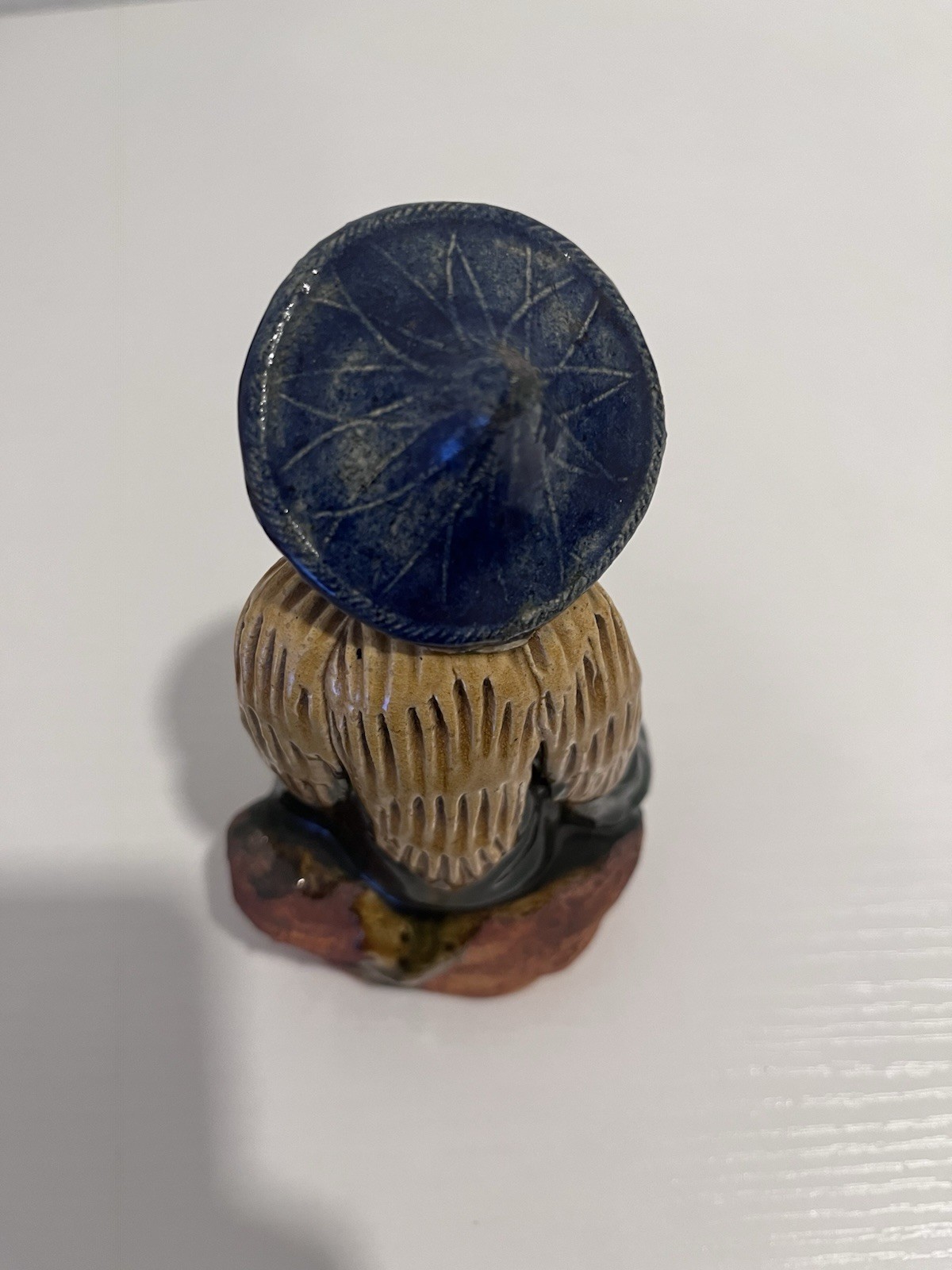 Vintage Chinese Ceramic Seated Mudman Figurine w/ Blue Hat Holding Pot