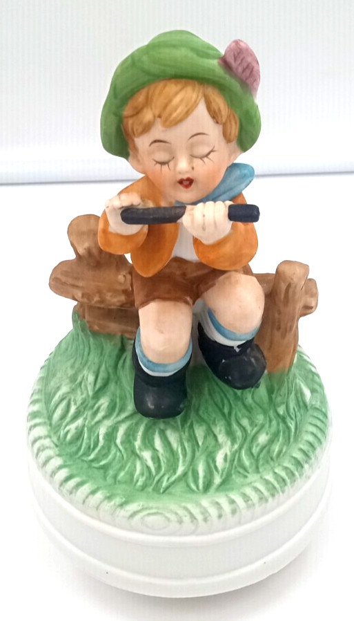 Vintage Boy Sitting On Fence Playing Flute 7″ Porcelain Figurine Music Box