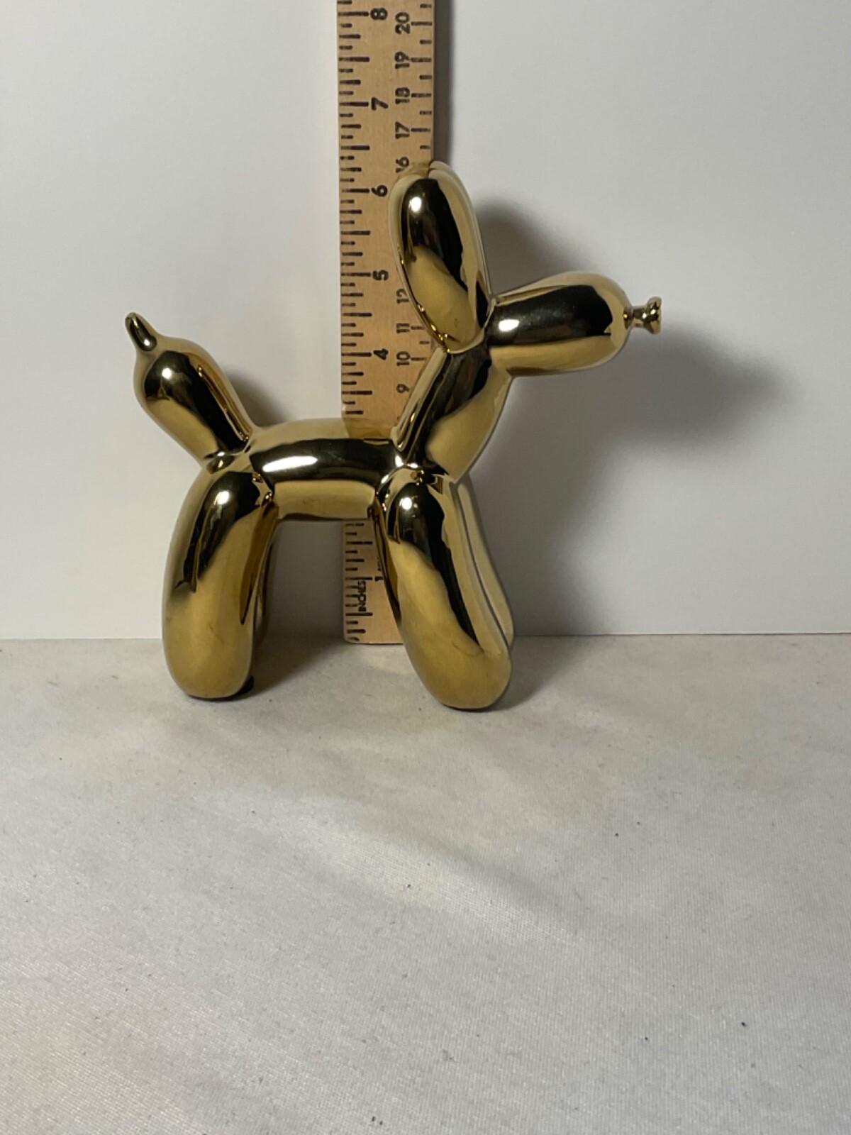 Ceramic gold colored balloon dog design figurine