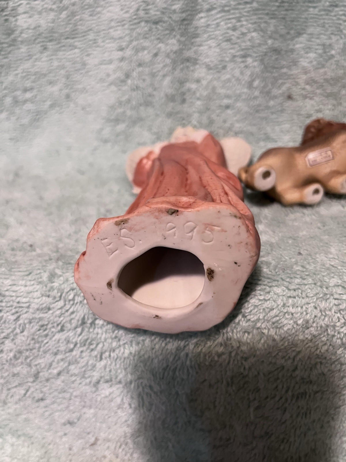 A Vintage Bisque Angle Figurine With Two Small Ceramic Lions