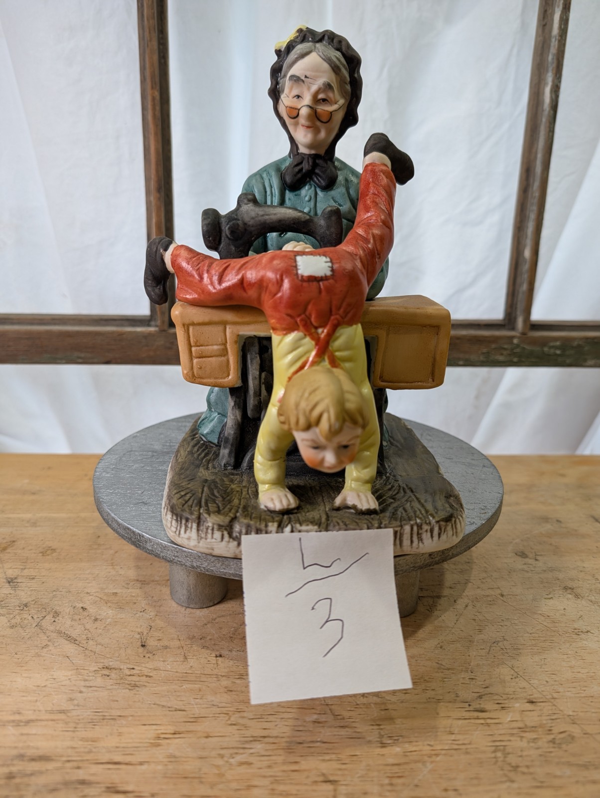 CERAMIC GRANDMA SEWING YOUNG BOY’S PANTS