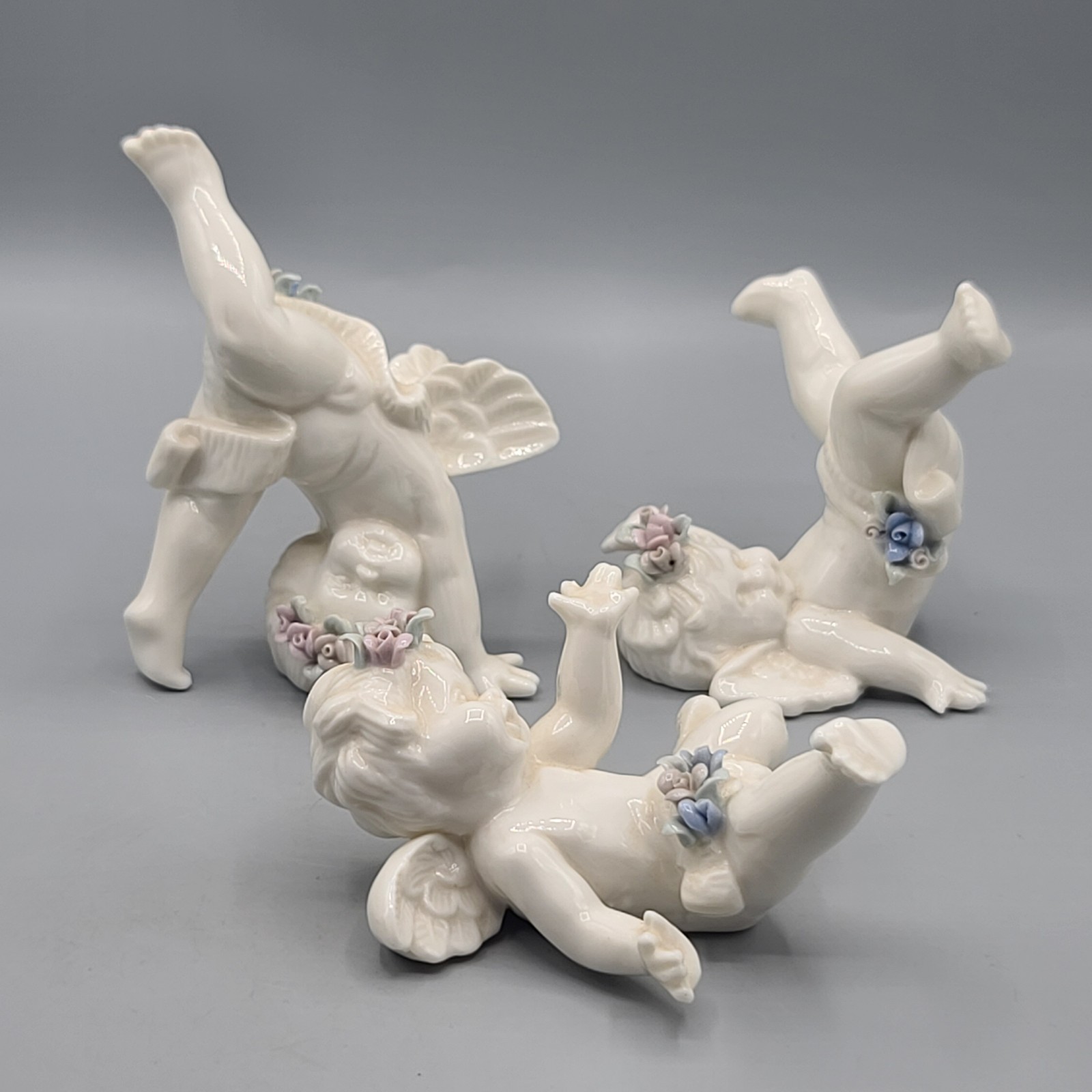 Ceramic Tumbling Baby Angel Cherubs Flowers Figurines Set Of 3