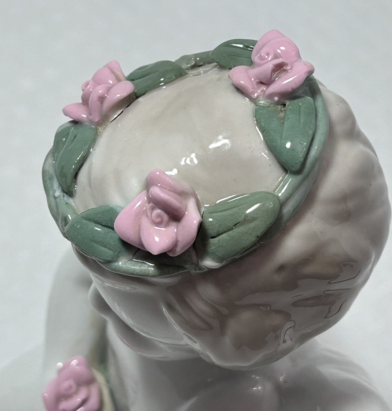 White Ceramic Kneeling Angel Holding Rose Cherub with Rose Wreath Garland 6”