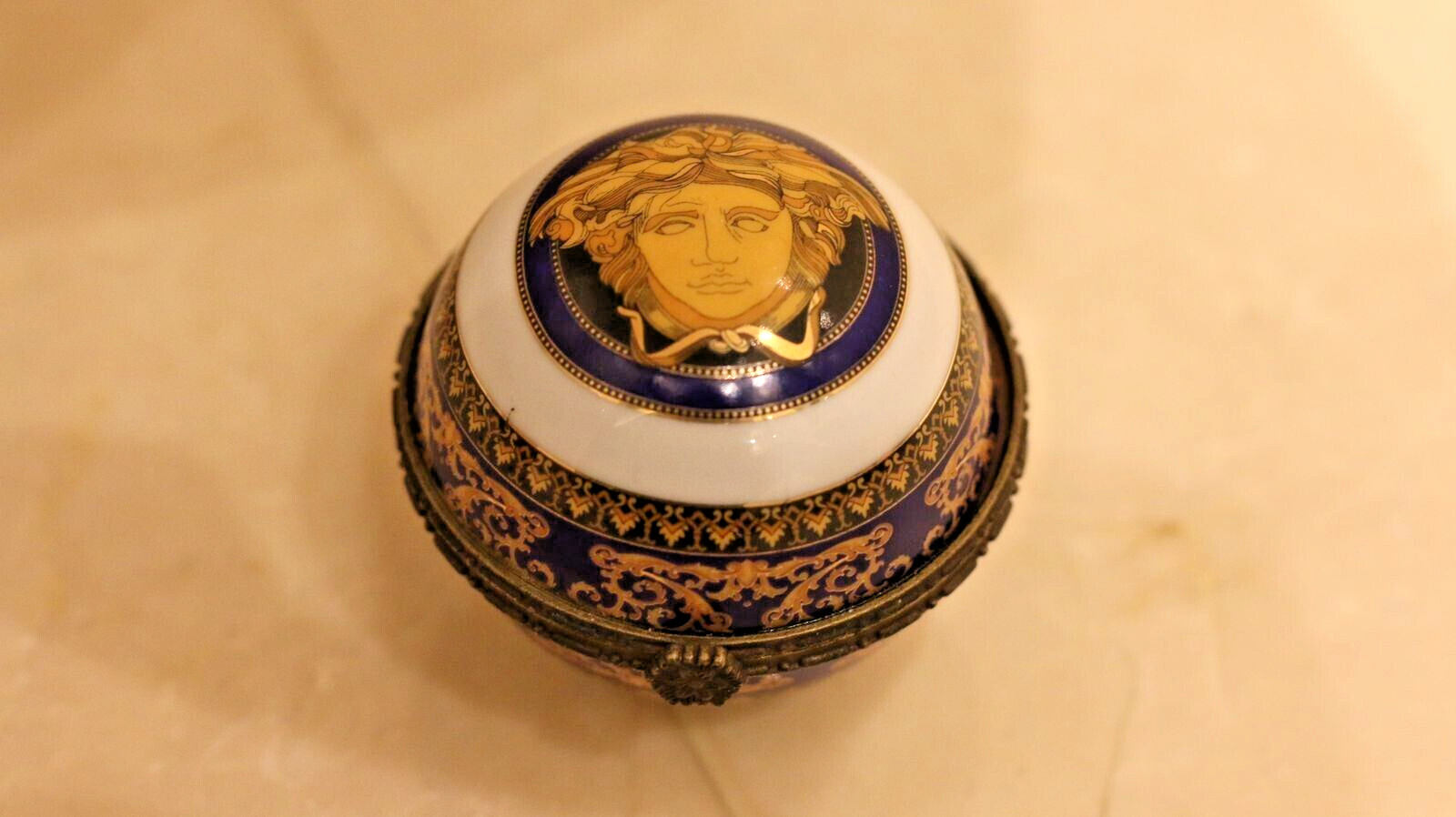 Versace Designs in white bohemian porcelain with blue and gold Medusa