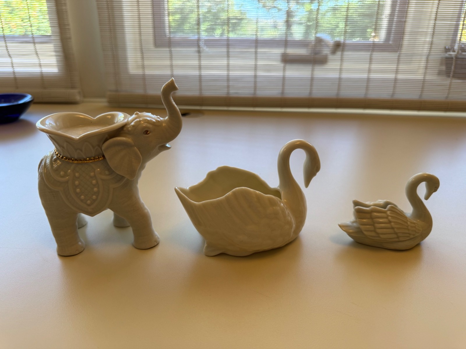 Lenox porcelain trio of animal figurines Elephant gold trim and 2 swans.