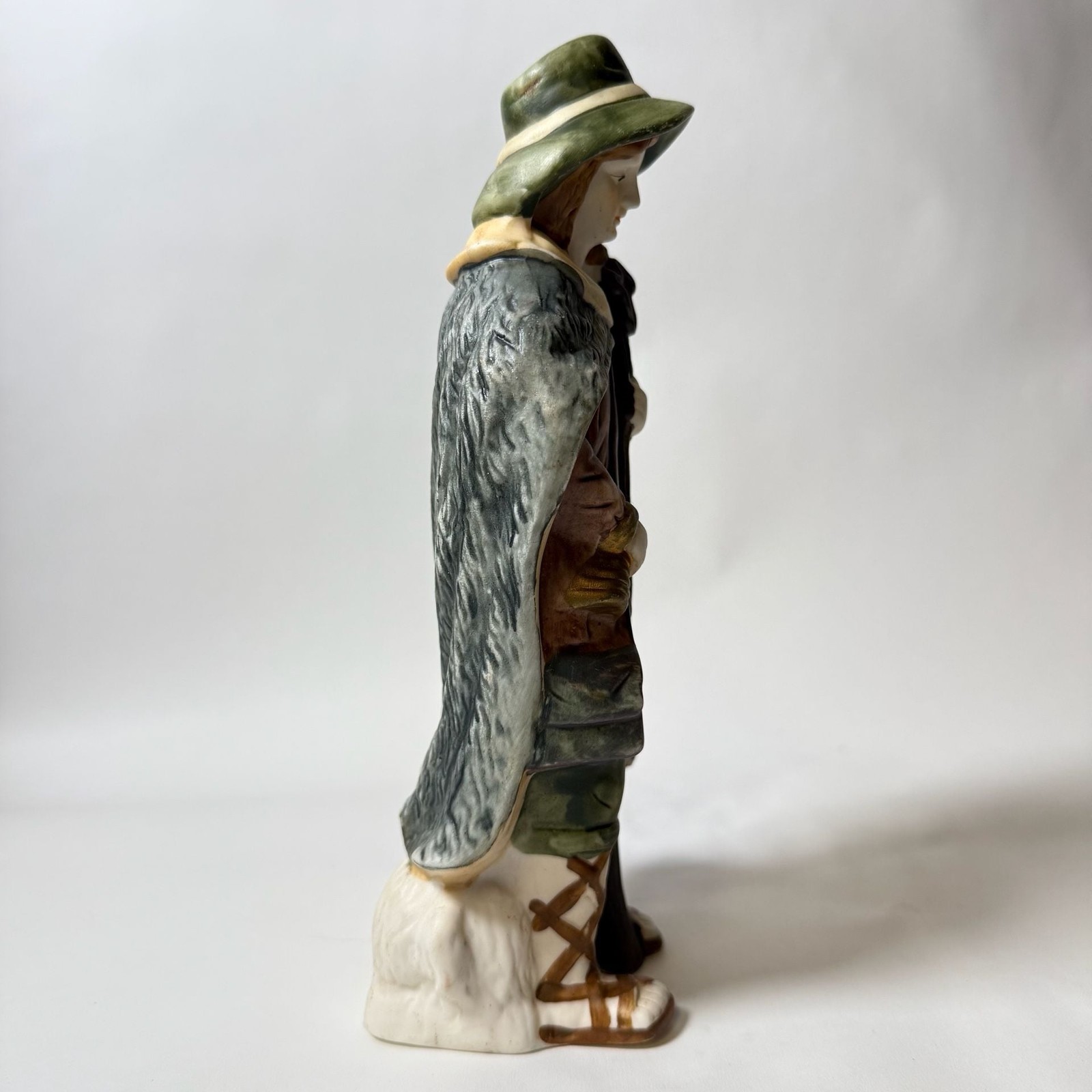 Vintage Porcelain Figurine of a Traveler with Staff and Bundle