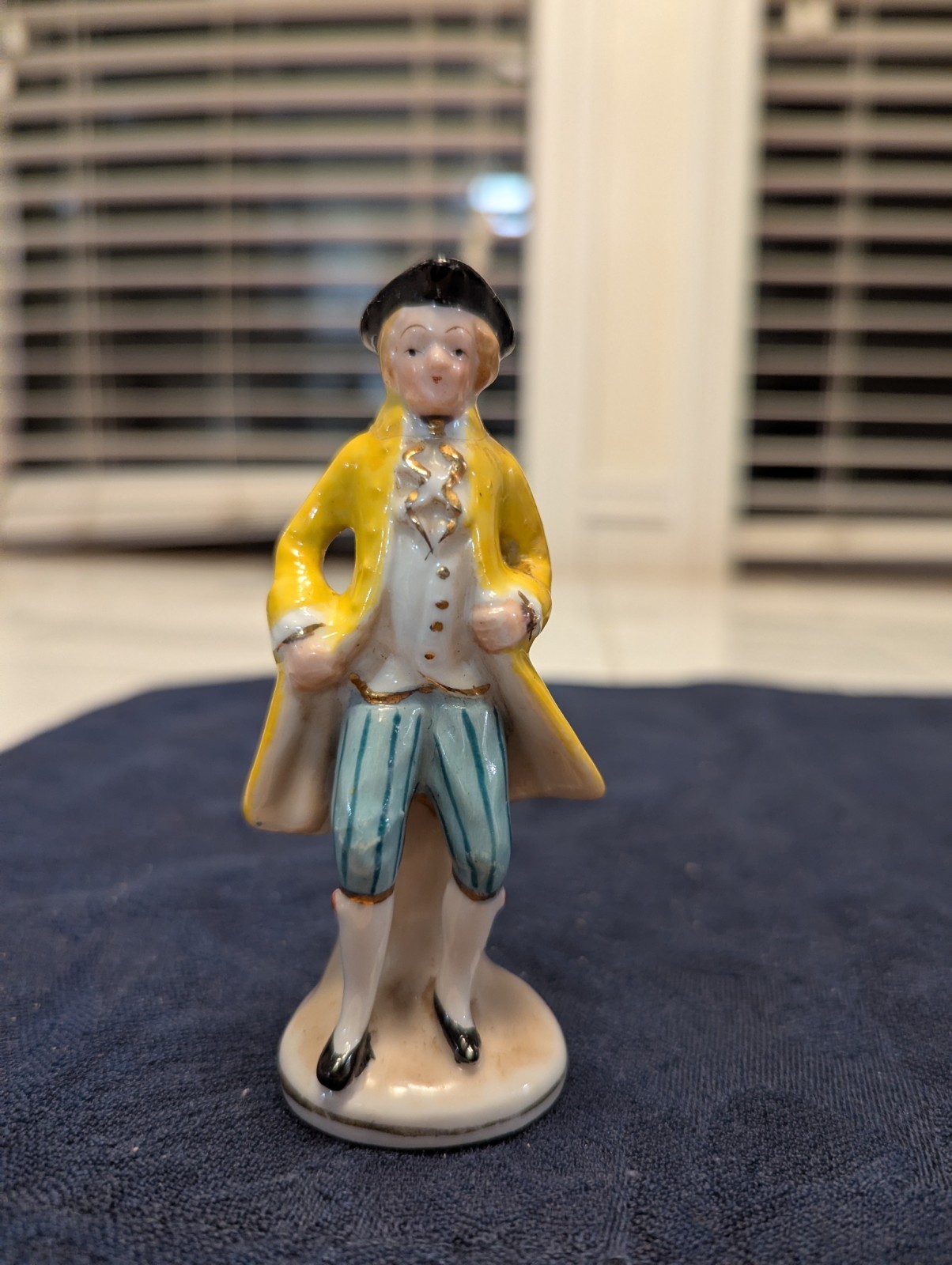 Two Mid-century Porcelain Colonial Figures Including A Small Toby Jug.