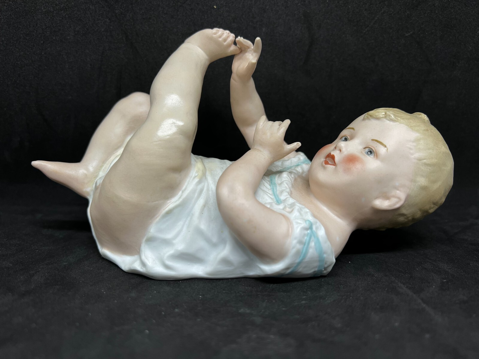 Gebruder Heubach-German Porcelain Bisque-Lying On Back Piano Baby-7 1/2″ Length