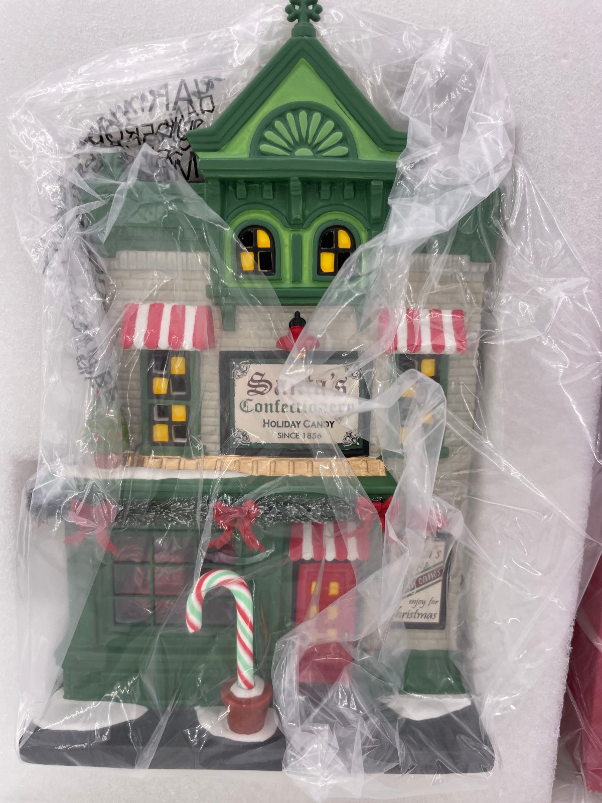 Department 56-Christmas in the City- Santa’s Corner Confectionery – 6013402