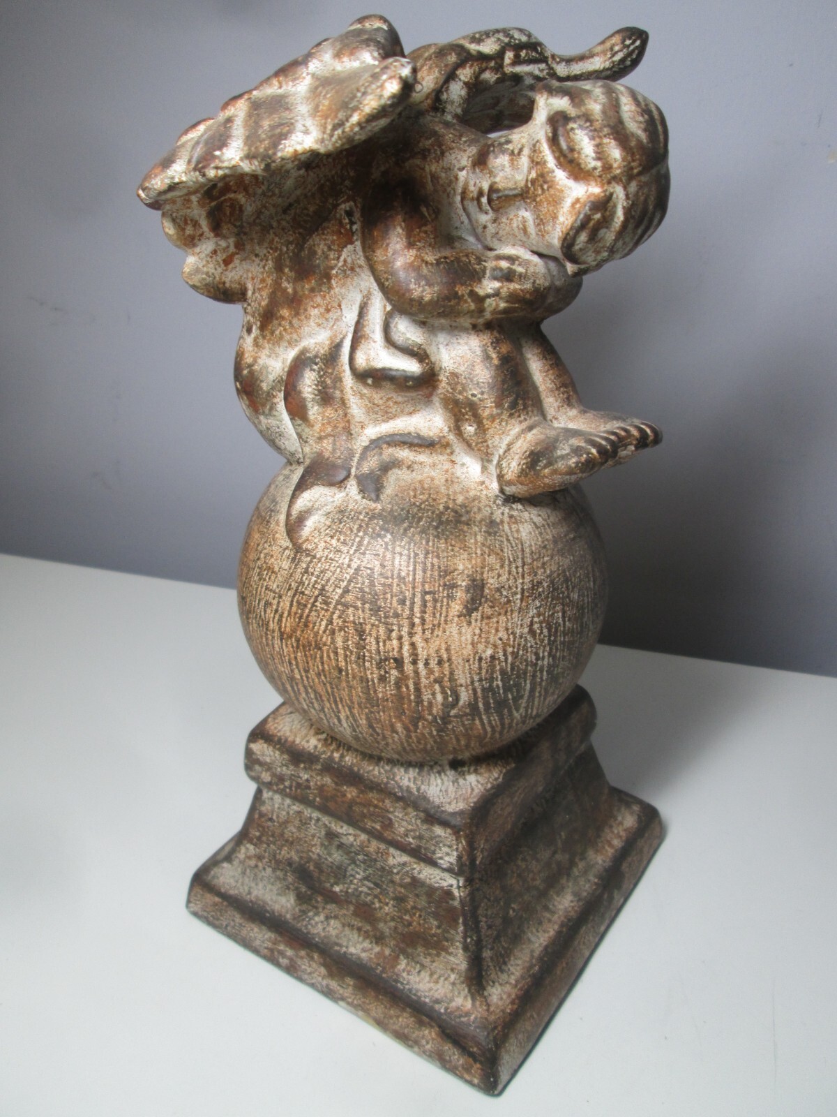Ceramic Cherub on a Globe inside or outside Décor