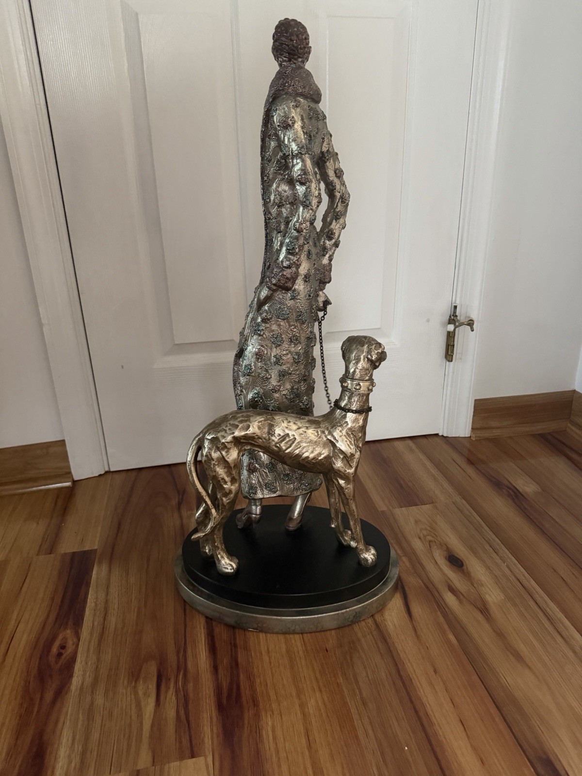 Metallic Finish Metal Figurine Woman with Dog on Round Base, Multicolor