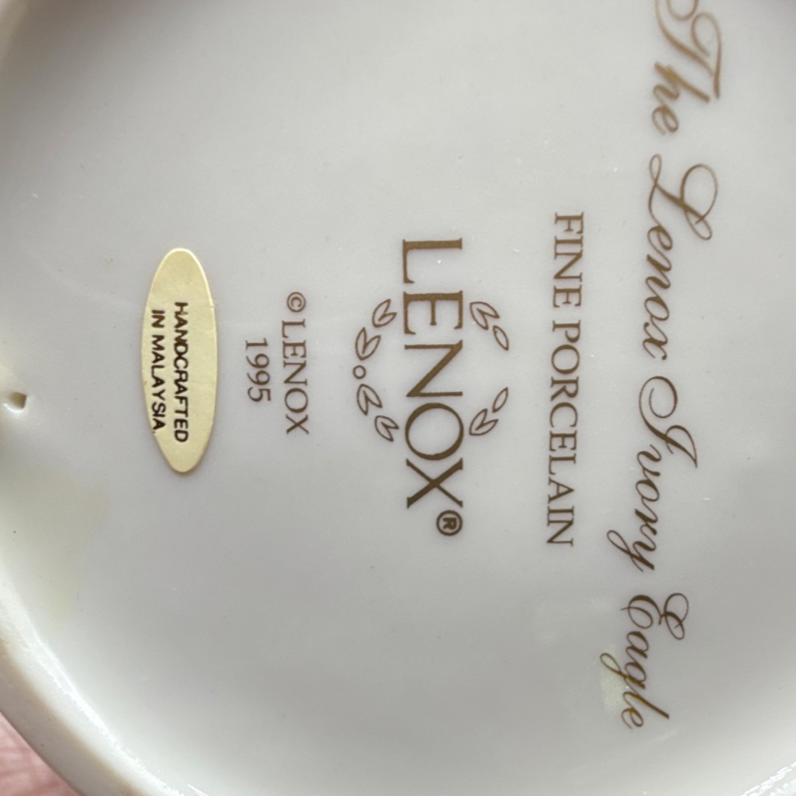 Lenox ivory and gold porcelain eagle figurine with glossy finish, 9 in