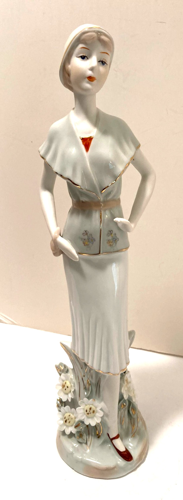Porcelain Figurine Young Woman in 20’s Era Design Suit Cloche w/Flowers Handbag