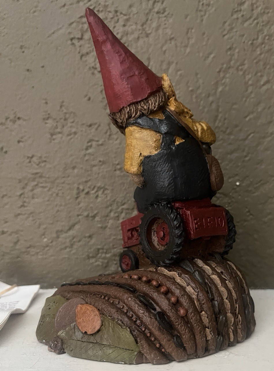 CAIRN STUDIO TOM CLARK GNOME “MACDONALD” ON TRACTOR IN FIELD #67 – 1987
