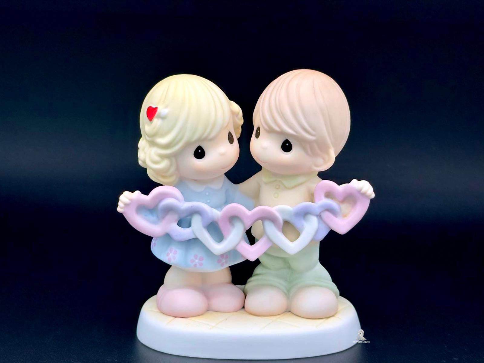 Precious Moments Figurine Boy and Girl Holding Hearts our Hears are Intertwined