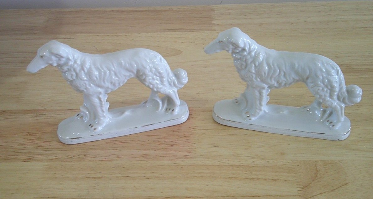 Pair of ceramic wolfhound figurines. 4 1/2 In. tall X 5 1/2 in. long