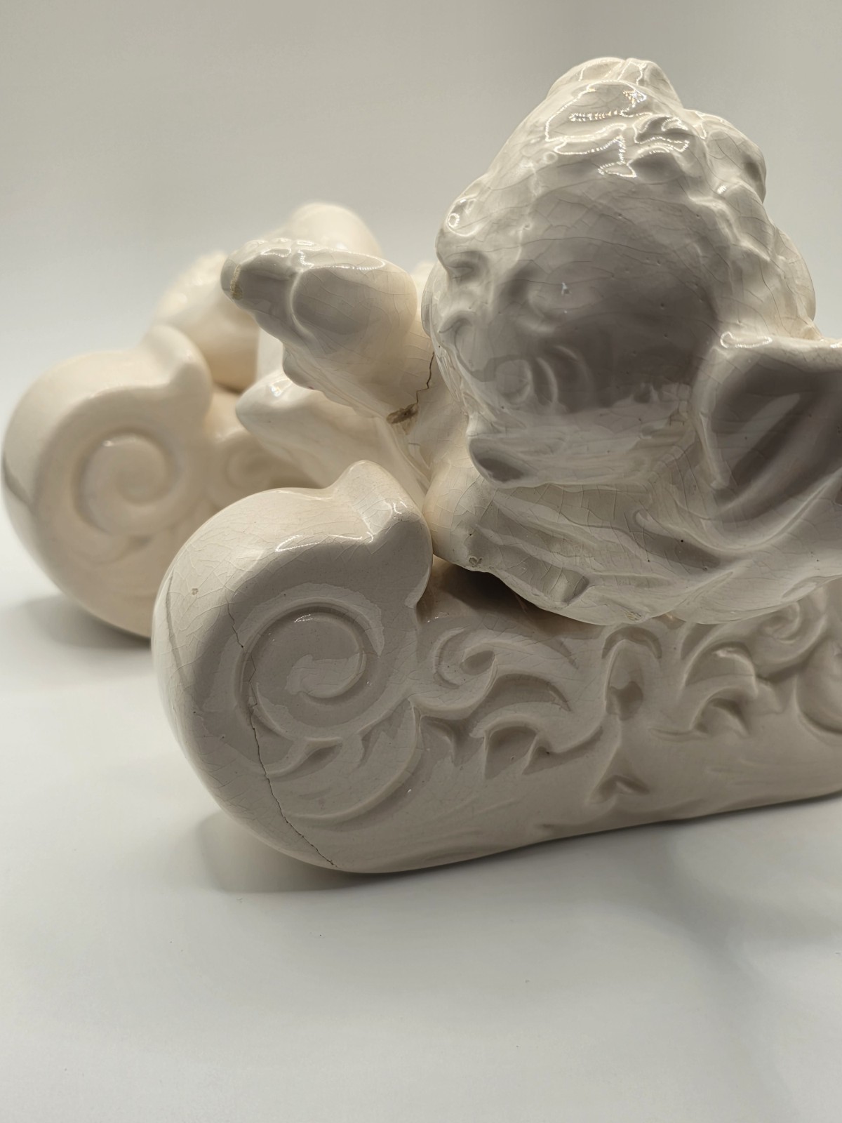 Vintage Ceramic Cherub Angel Figurine Reclining on Scroll Base – Cracks/Read