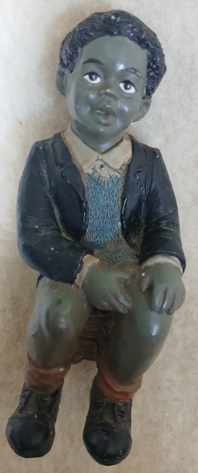 FIGURINE/YOUNG BOY SITTING ON A STOOL-YOUNG COLLECTION FIGURES-PRE OWNED