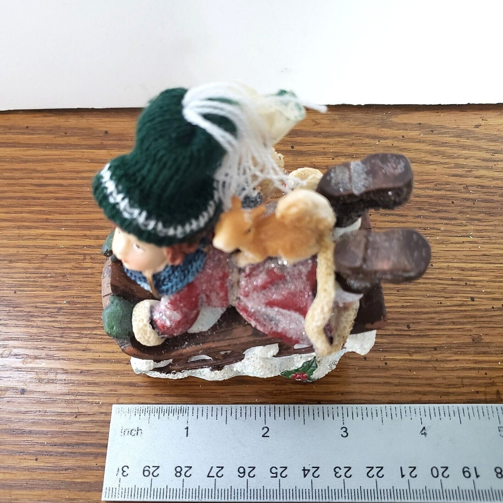 Girl Sledding with Squirrel Resin Figurine with a Real Knitted Stocking Cap
