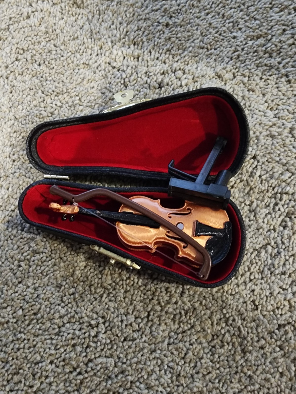 collectible miniature violin musical instrument replica, typically measuring…