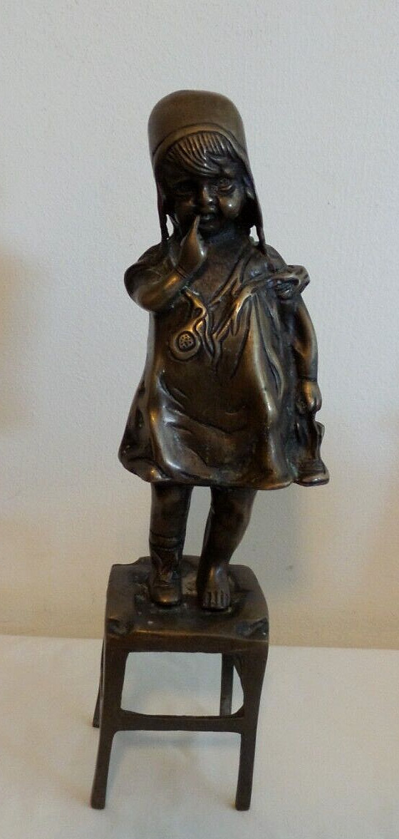 BEAUTIFUL REPRODUCTION LITTLE BRONZED GIRL ON CHAIR WITH SHOE – 11 7/8″