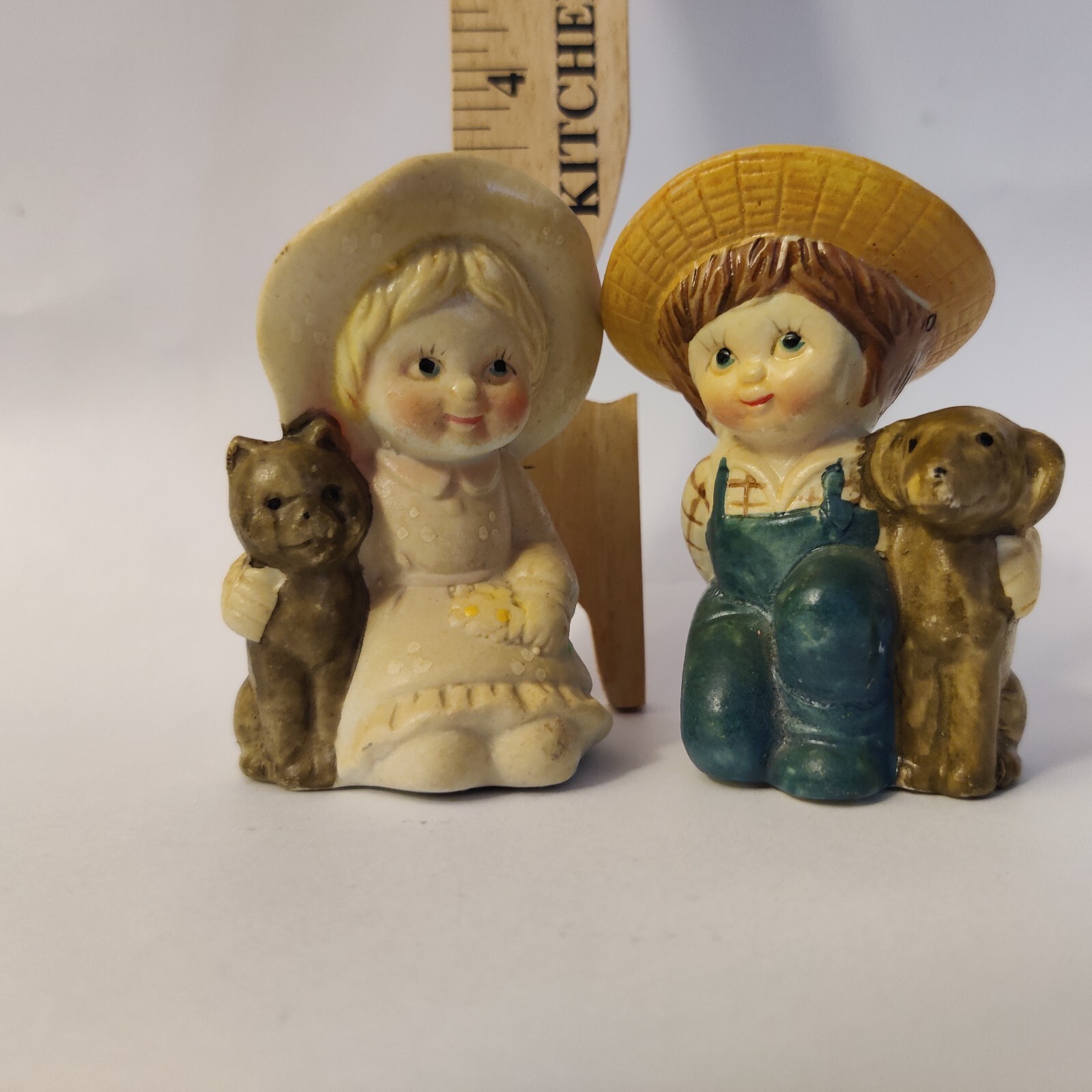 Boy and girl small figurines with dog & cat both with hats cute unsure of origin