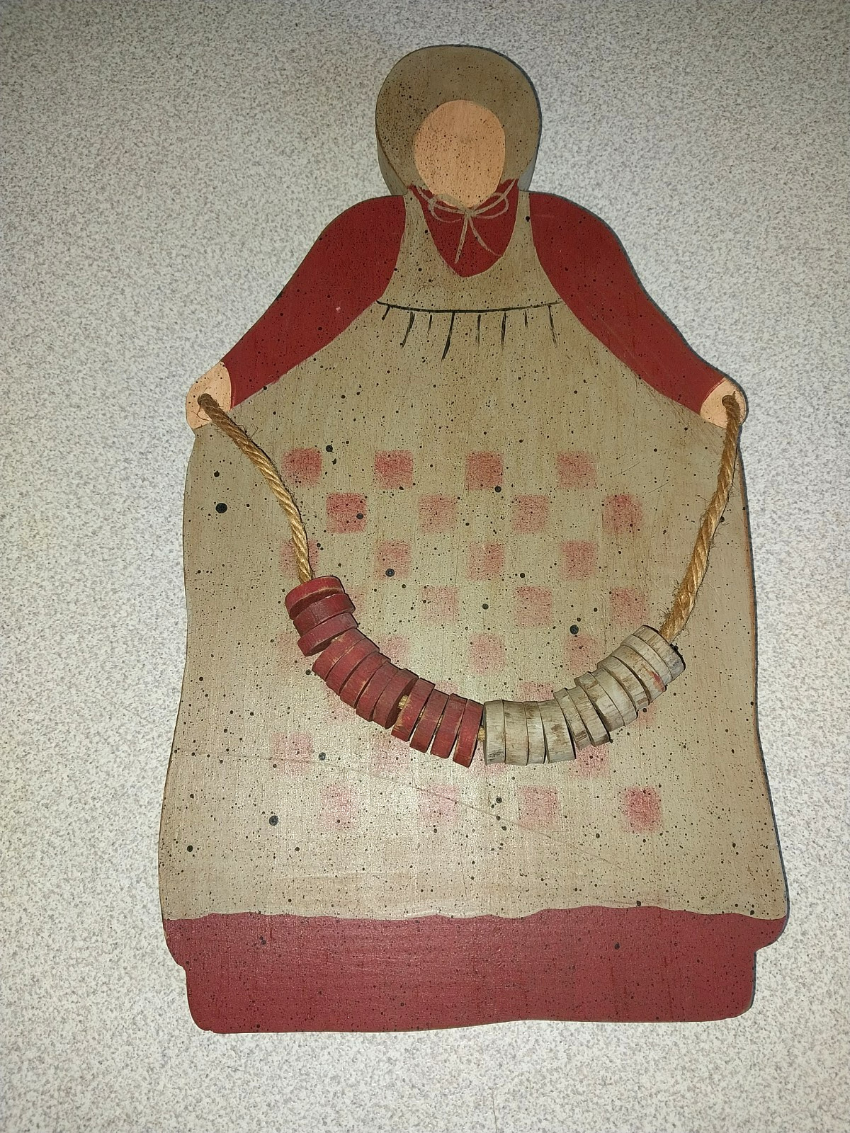 VINTAGE HANDCRAFTED FOLK ART WOODEN FIGURE WITH CHECKERBOARD APRON WALL DECOR