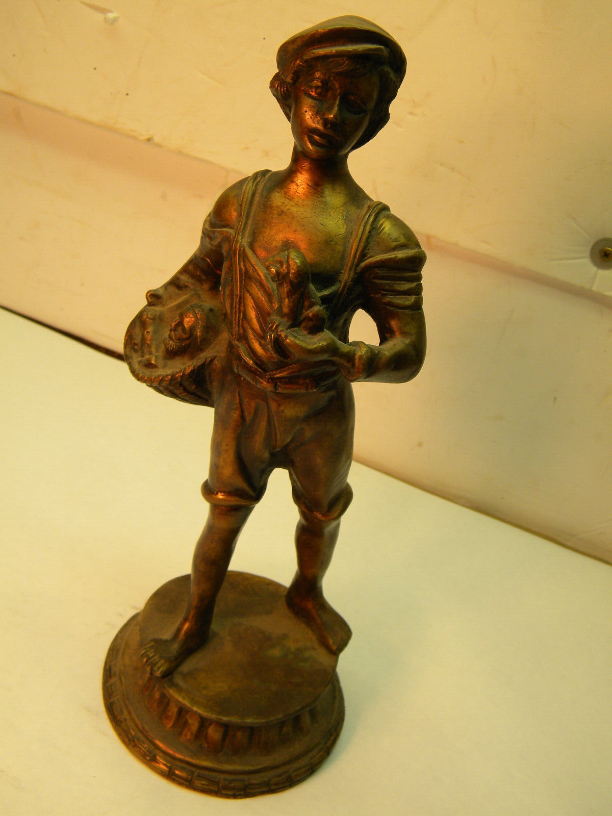 Bronze 12.5 in. Figurine; Italian Boy taking figurines to market in a Basket