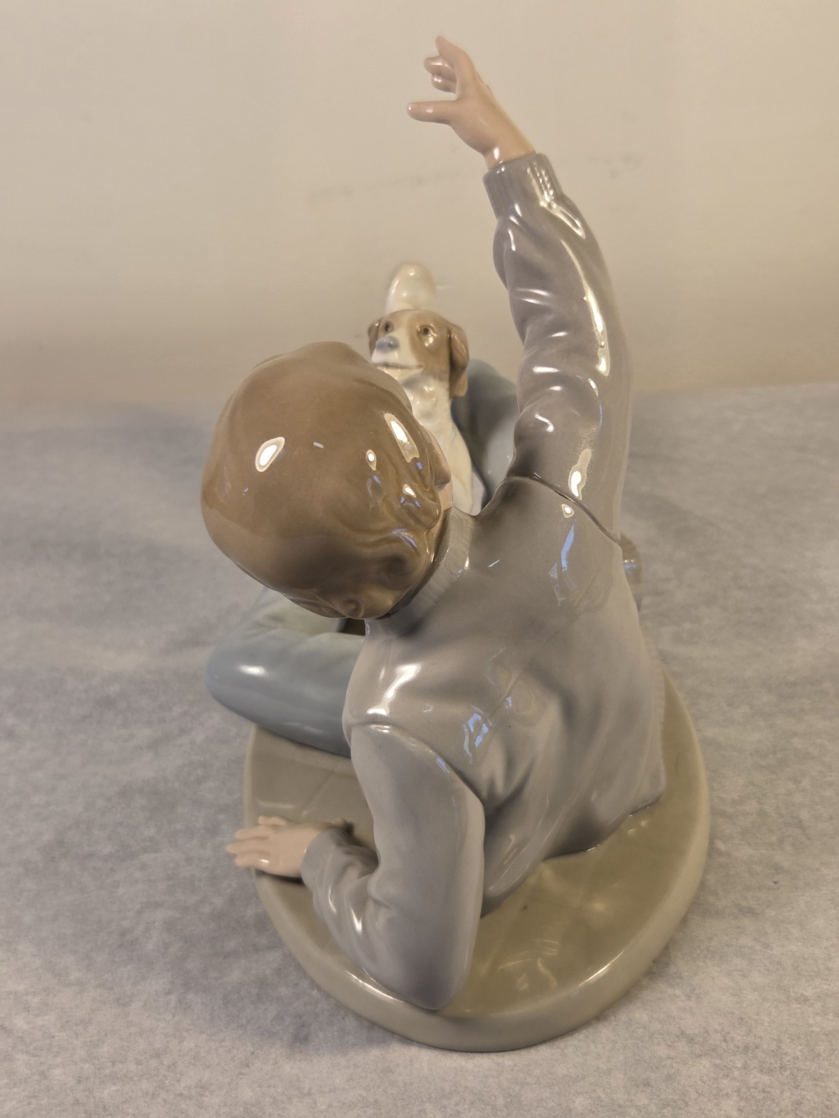 NAO by Lladro Figurine “Boy Playing with Dog” Model #0278 8″ Long x 6.5″ Tall