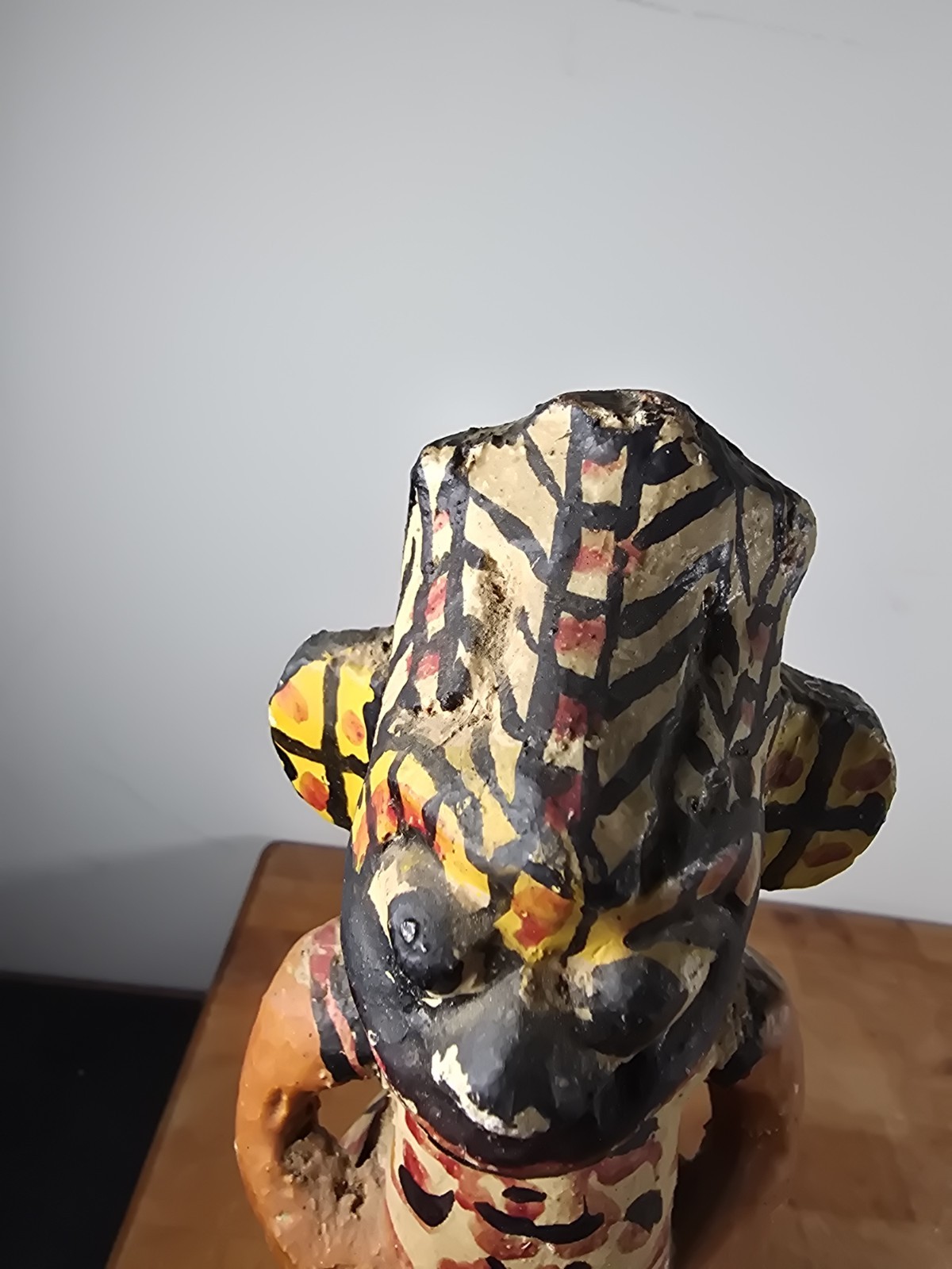 Folk art carved wood figure masked