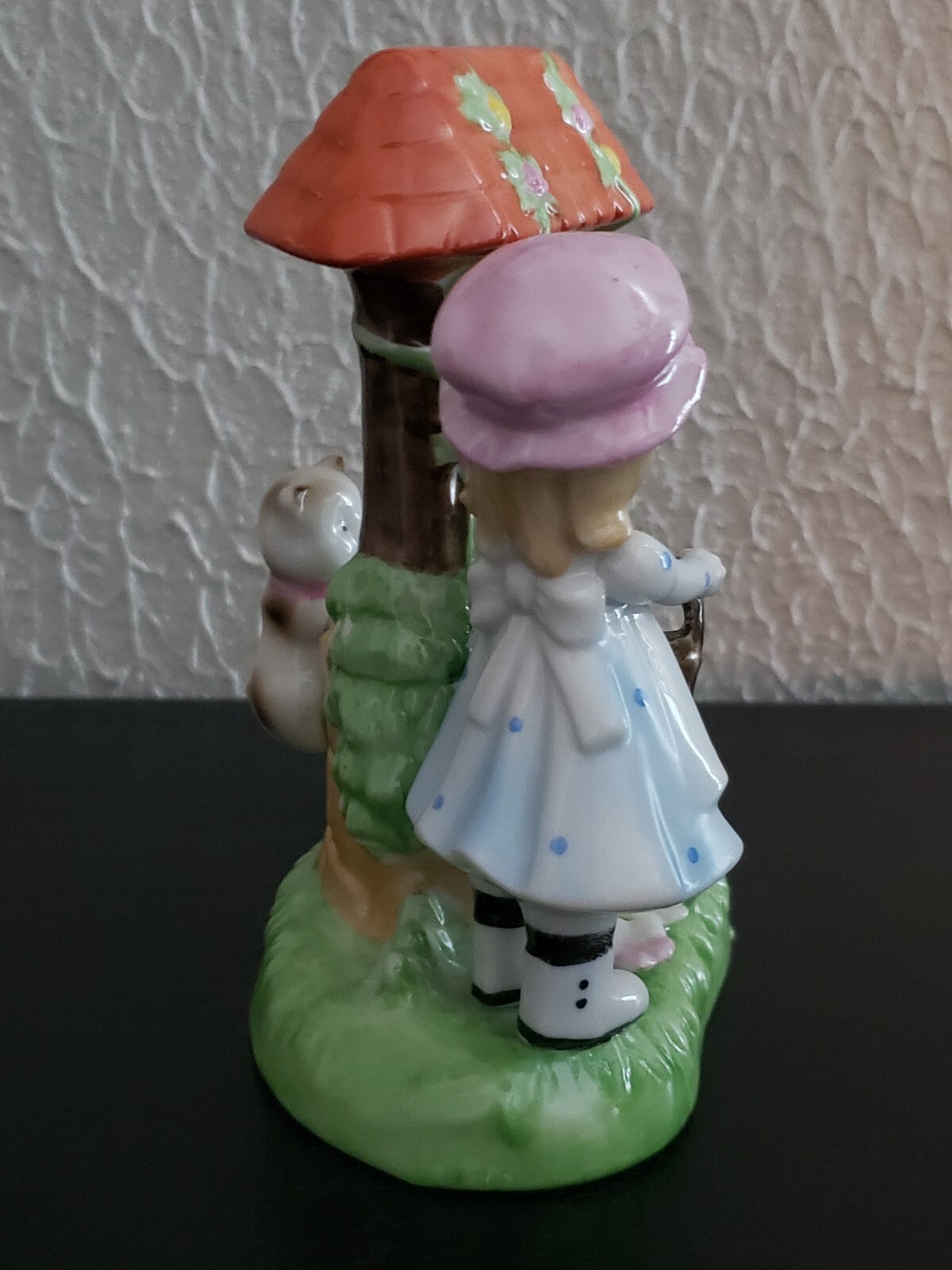 Vintage girl with cat at wishing well hand painted figurine made in Korea