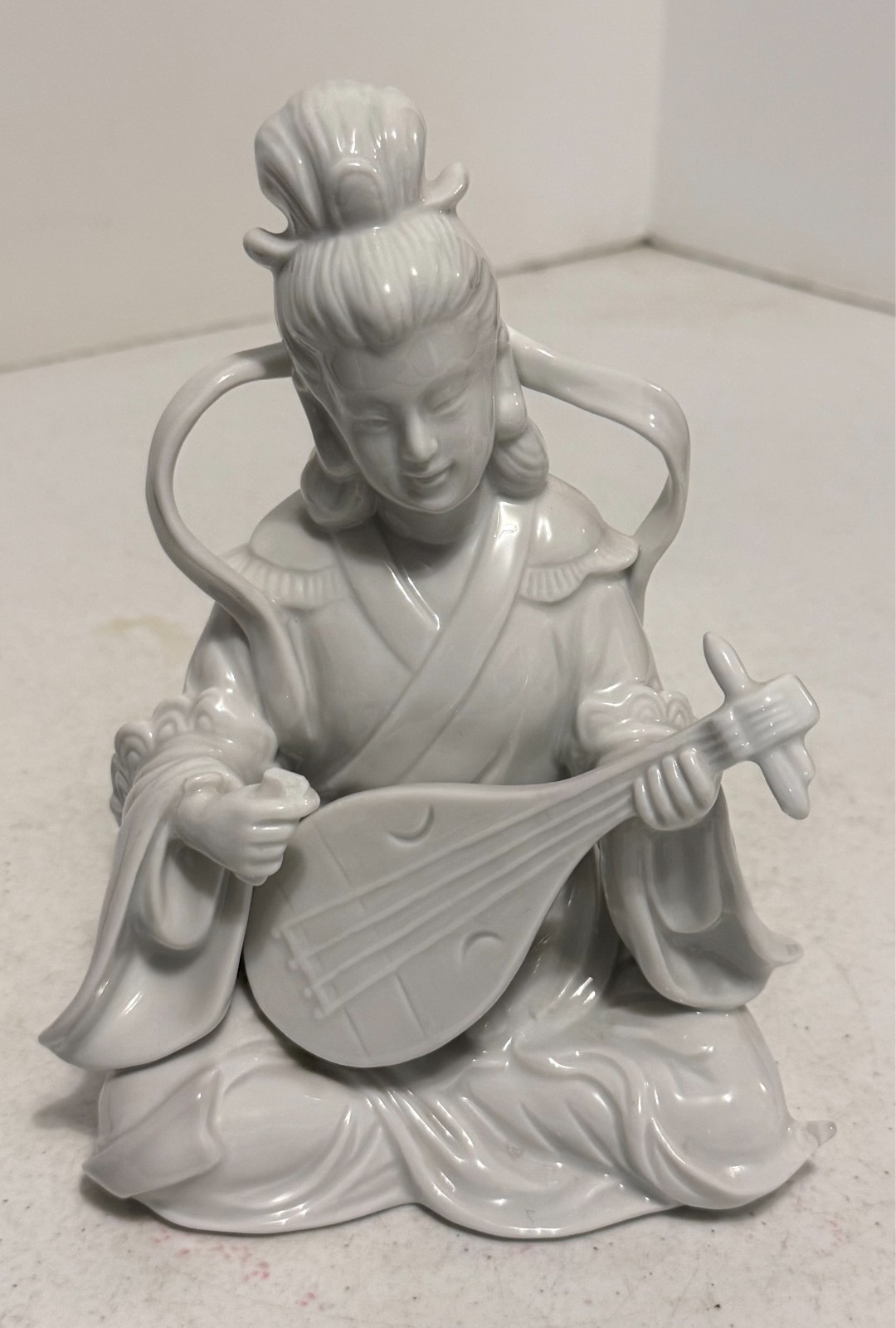 Japanese White Porcelain Geisha Sitting Playing a Biwa