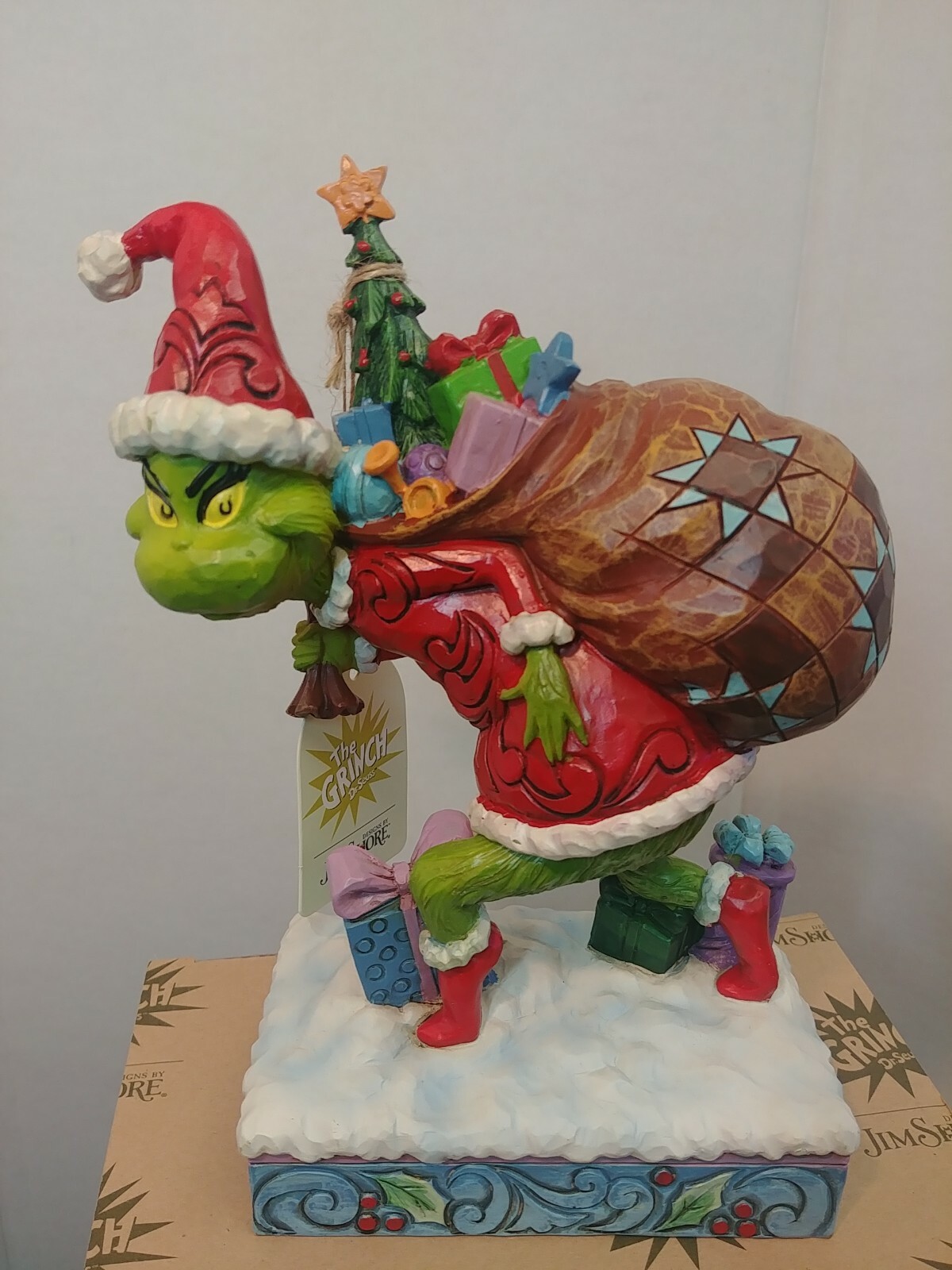 Dr. Seuss Grinch by Jim Shore Grinch Tip Toeing with Bag of Gifts 7.7″ Figurine