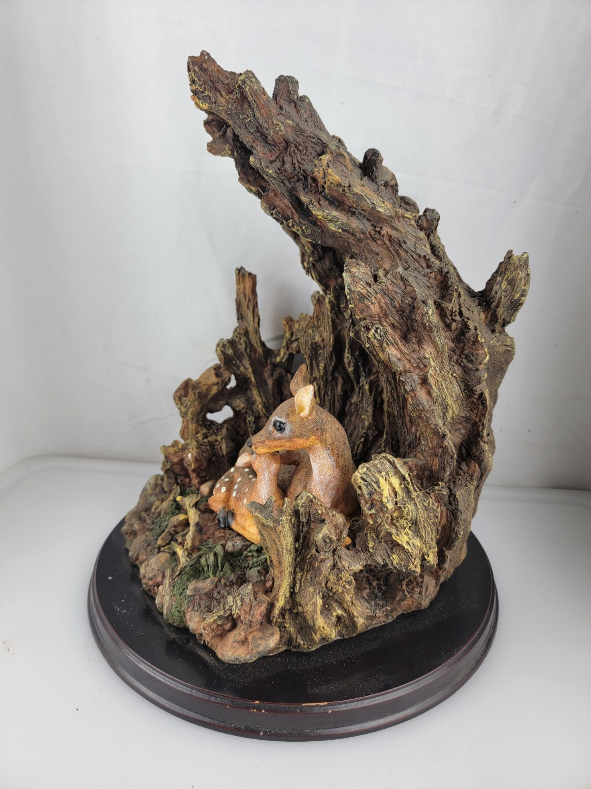 12″ Masterpiece Resin Deer, Fawn Resting Cave/ Tree Trunk Wodeen Base