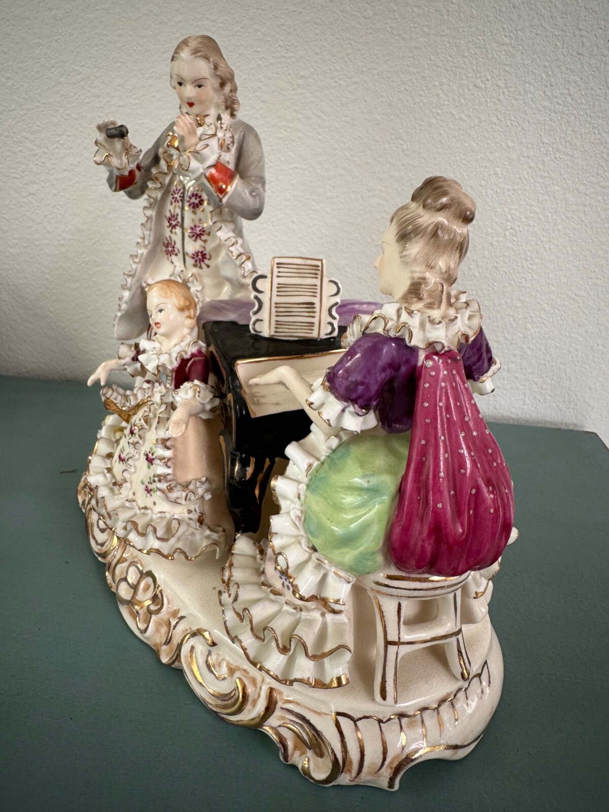 Vintage porcelain musical trio. 8” tall and 8.5 width