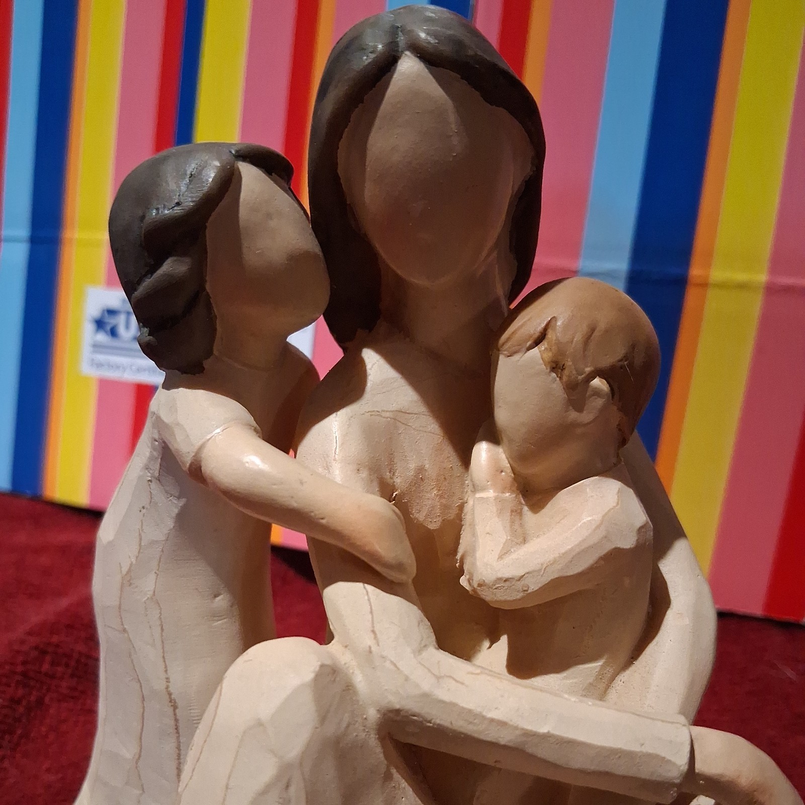 Mother Figurine holding children quietly .medium size..unmarked