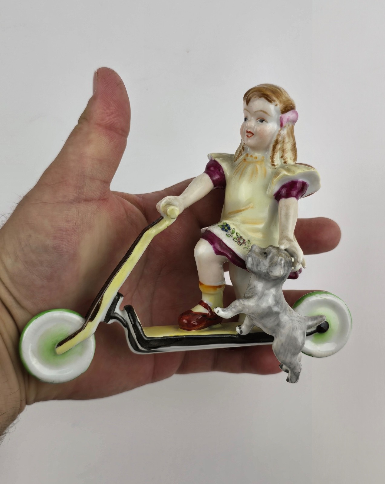 Vintage Hand painted Porcelain Girl on Scooter with small dog Unmarked