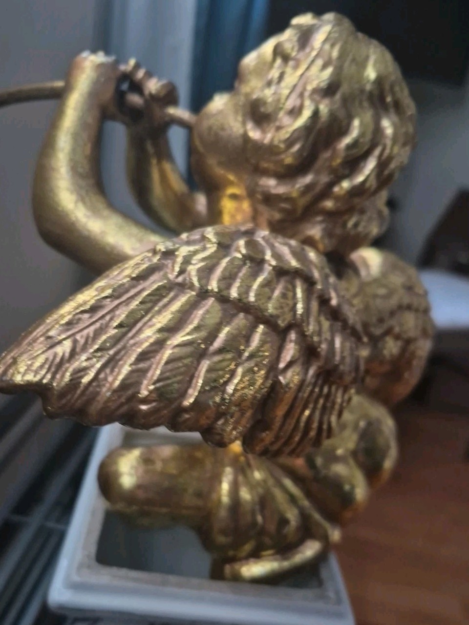 Golden Cherub With Horn