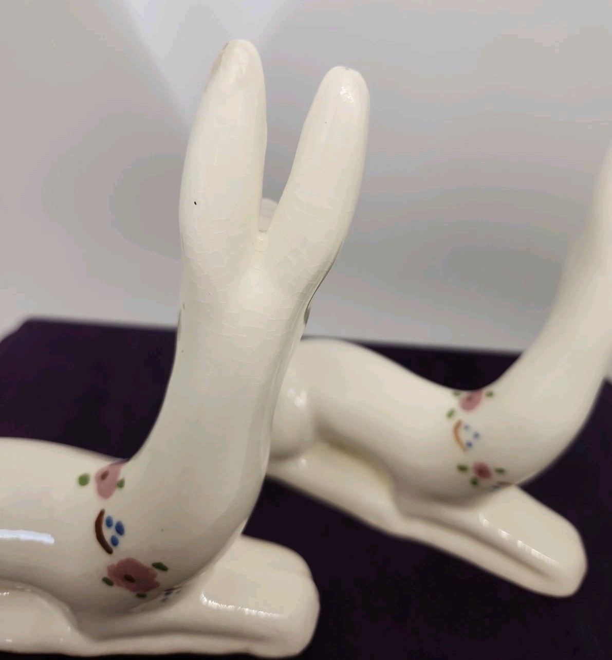 Vintage ceramic deer figurine with painted floral accents. “T” & “W” Marking.