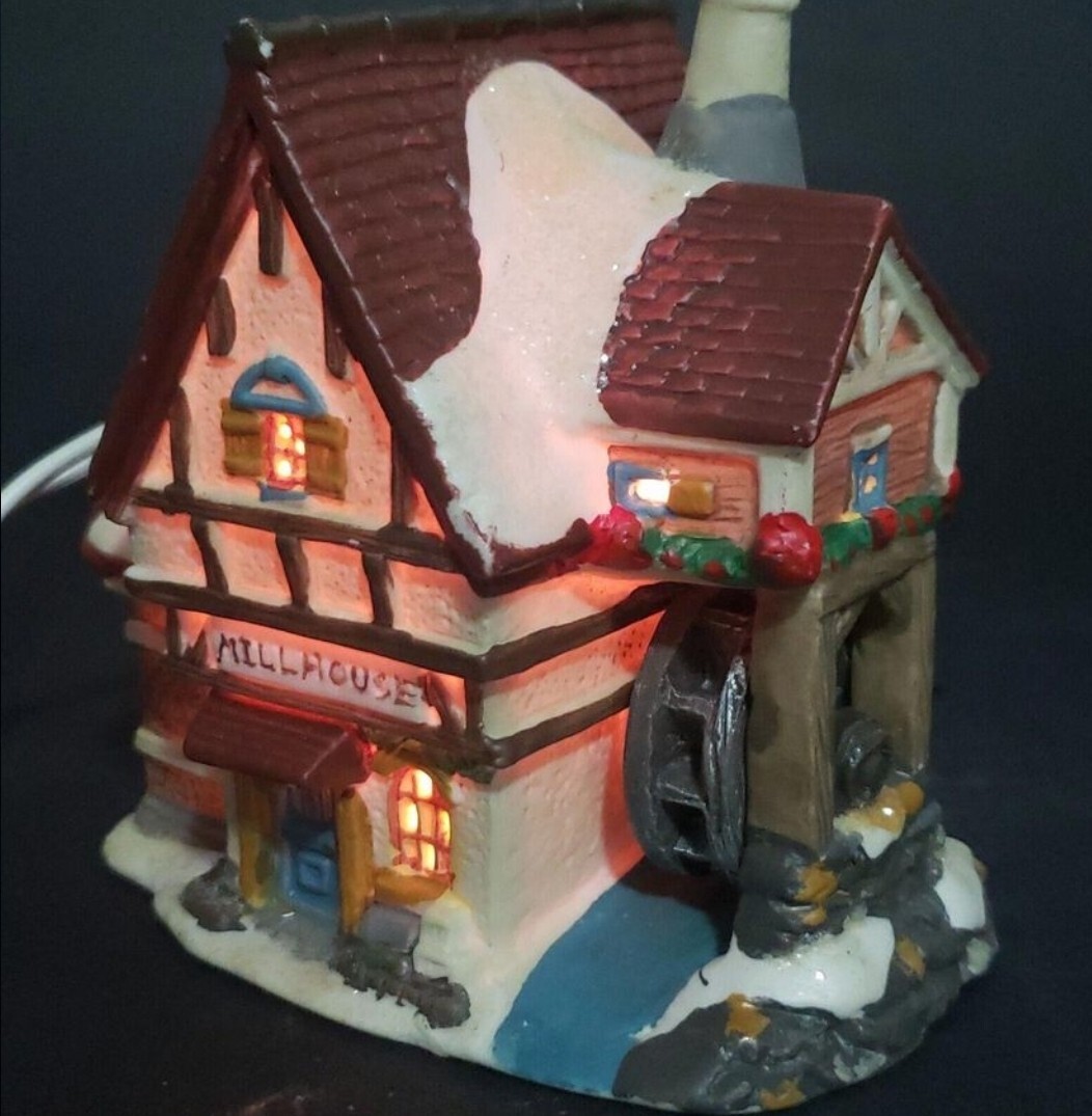 Charming Handcrafted Millhouse Figurine with Snow-Capped Roof and Flowing Water.