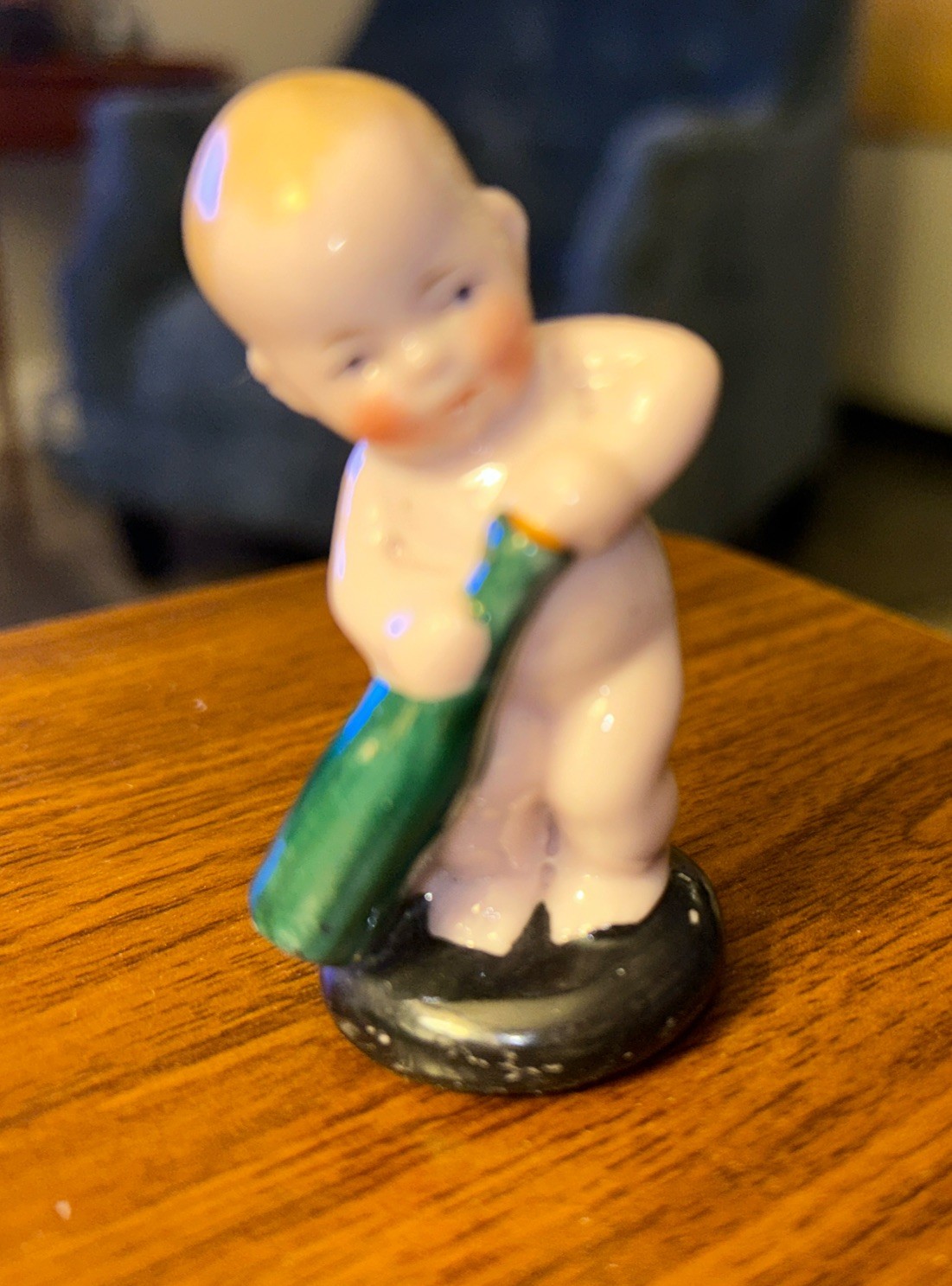 Vintage Porcelain Baby Pulling Cork From Bottle Figure