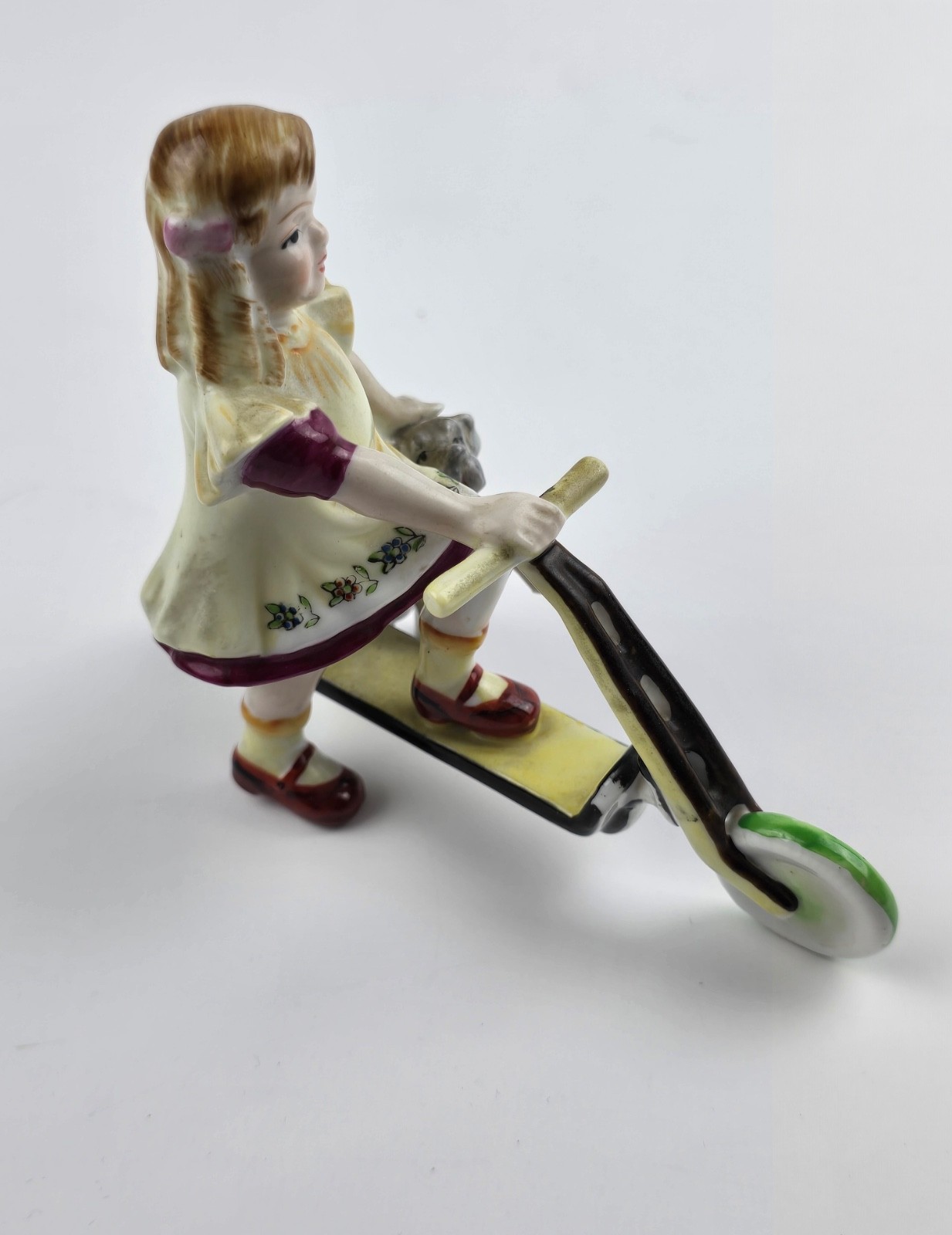 Vintage Hand painted Porcelain Girl on Scooter with small dog Unmarked