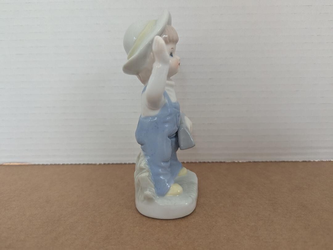 Vintage Girl Figurine Porcelain Girl with Purse wearing Overalls